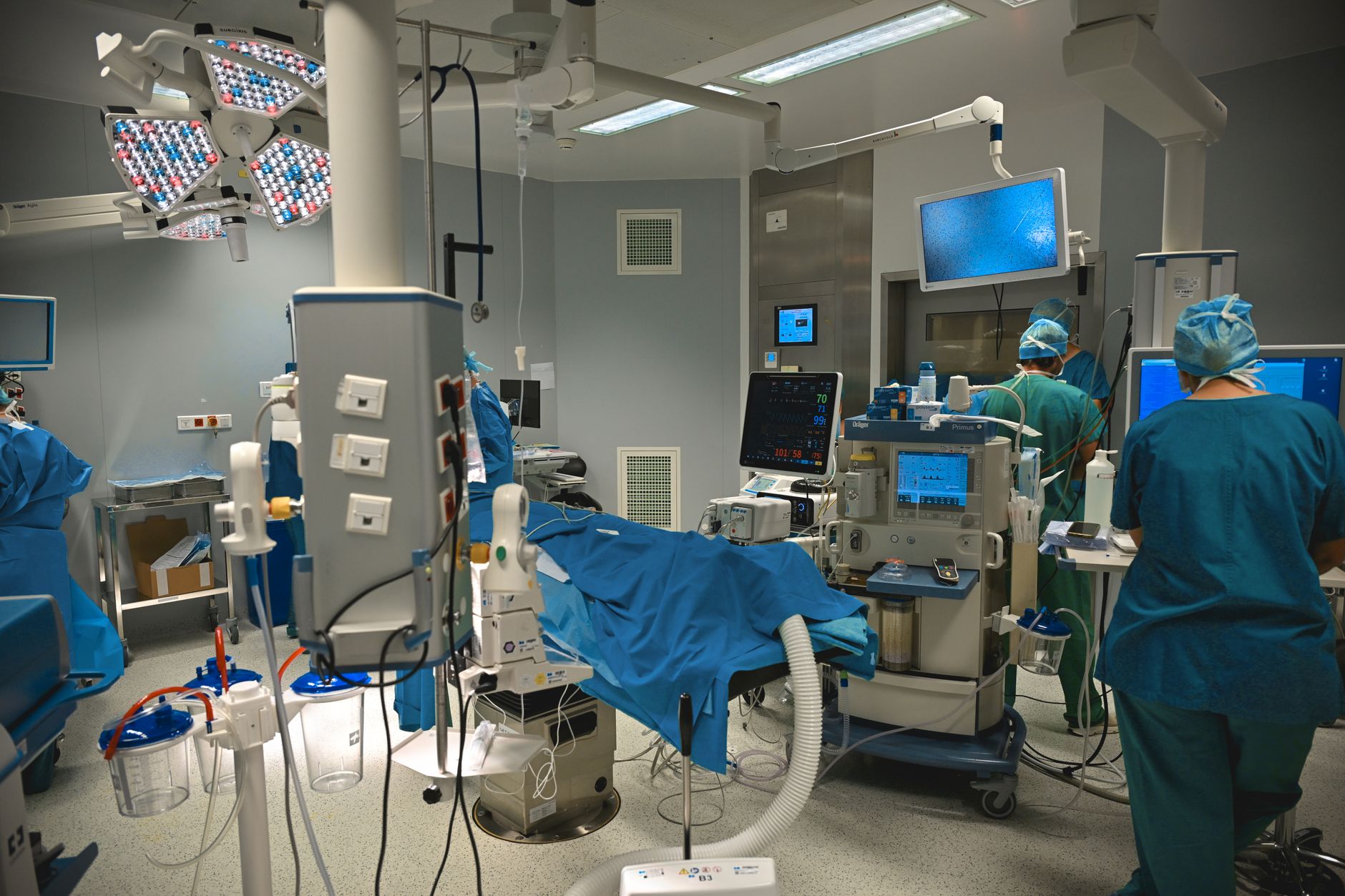 advanced surgical operating room with medical staff