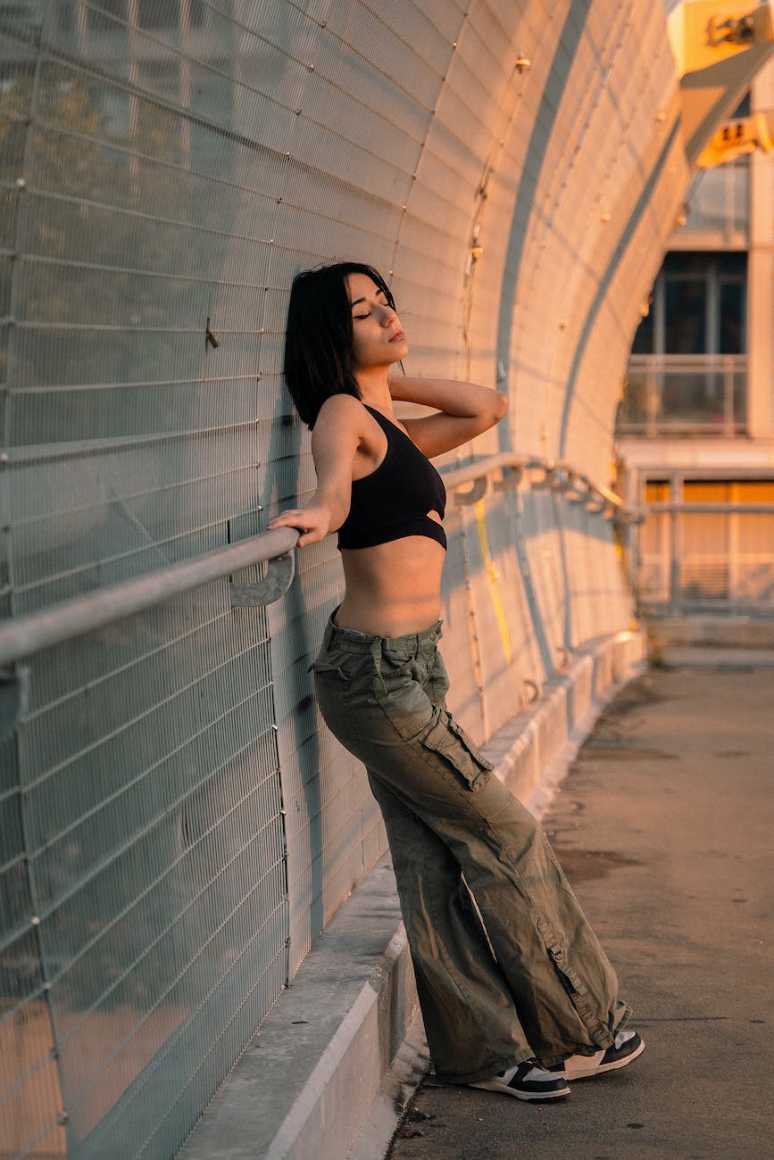 model in cargo pants and black top